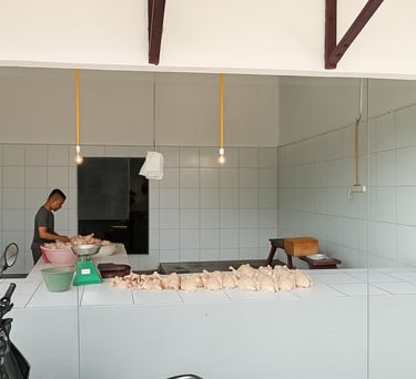 a man standing in a kitchen with a large counter top