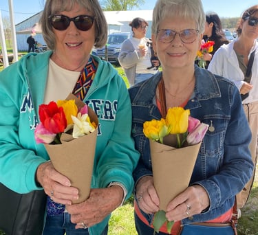 Ladies holding bouquets of tulips at the u-pick flower farm