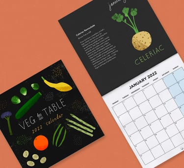 Seasonal eating calendar mocked up on an orange background.