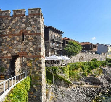 a stone wall with a bridge and a bridge over it
