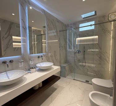 a bathroom with a large mirror and a sink