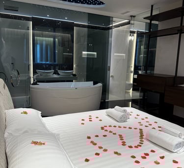a bed with a large bed and a bathtub