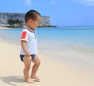 baby on a beach in bermuda