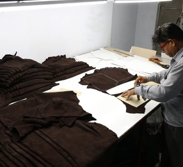 Man Cutting Leather