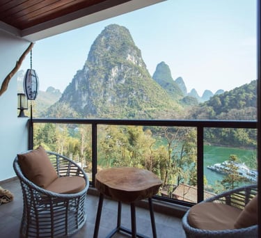 View the scenery from your private balcony at the Yangshuo Li River Resort