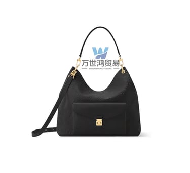 Black embossed leather monogram hobo bag with gold hardware and a front pocket.