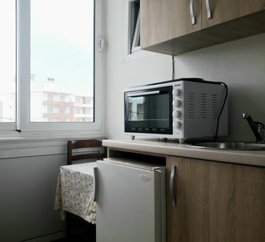 a microwave with a microwave oven and a small table
