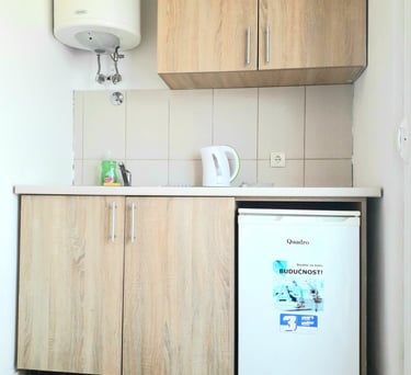 a kitchen with a refrigerator and a refrigerator freezer