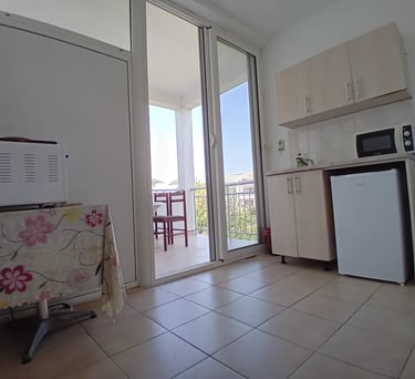 a kitchen with a refrigerator, microwave, and refrigerator freezer