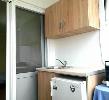 a kitchen with a refrigerator and a microwave