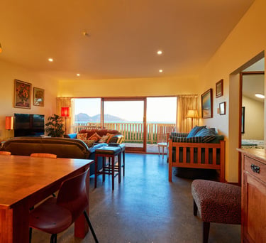 Open-plan kitchen, dining and lounge area at The Cottage Kaikōura