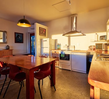 Kitchen and dining area inside The Cottage accommodation in Kaikoura