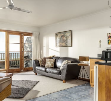 Living area and deck doors inside The Studio Kaikoura