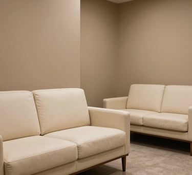 An interior shot of a serene, professional waiting area with high-end ivory upholstery and tan walls, North American / US style, minimalist and calming.