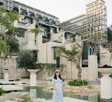 Luxury portrait session beside the reflection pool at The Apurva Kempinski Bali in Nusa Dua