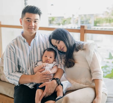 Family portrait with their baby inside a suite at Samabe Bali Suites & Villas in Nusa Dua.