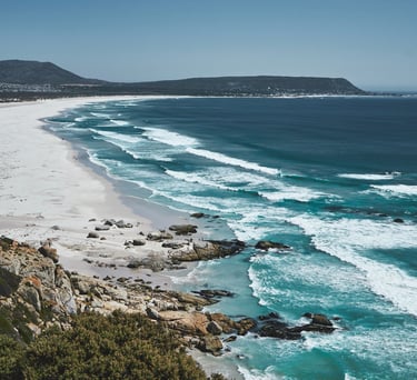 Rolling waves of Noordhoek beach from Chapmands Peak 