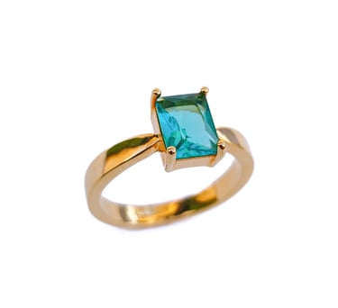 a ring with a green emerald colored stone