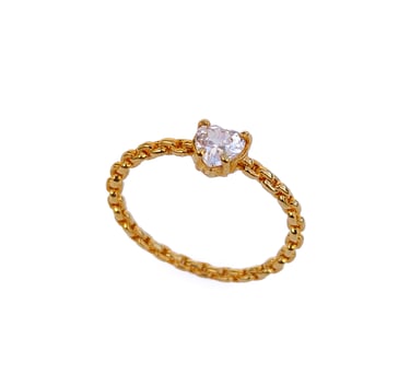 a diamond ring with a diamond and a gold ring