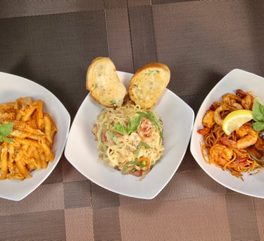 three plates of pasta Penne, Carbonara and Seafood Marinara