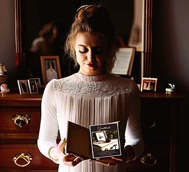 Young woman reading personal development journal