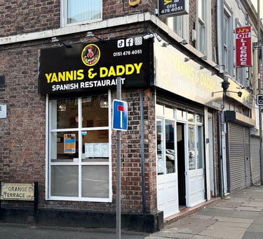 a restaurant with a sign that says Yannis and daddy