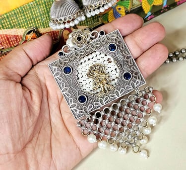 German Silver oxidized set with pearl detailing from Iridezza Jaipur Edit collection.