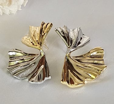 Two-tone sculptural statement earrings in gold and silver finish – Iridezza Global Glam edit