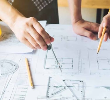 a man and woman working on a project