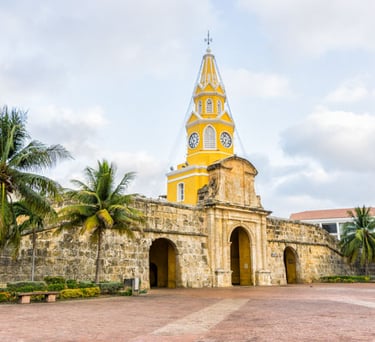 a church with a clock tower in the background