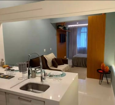 a kitchen with a couch and a sink