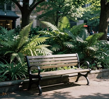 A serene photography shot of a sunlit city park in North America, focusing on a quiet bench surrounded by lush greenery and soft shadows.