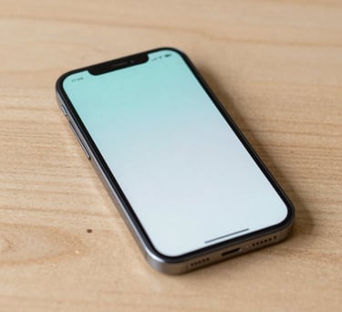 A close-up photograph of a modern smartphone resting on a light wood table, displaying a clean and soft user interface with light aqua accents, North American / US setting.