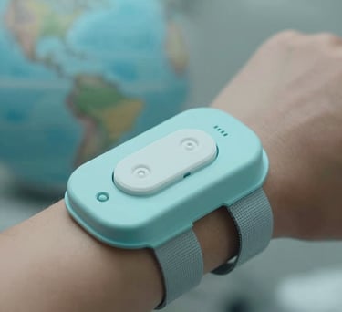 A close-up of an innovative wearable health sensor being used in a medical setting, North American / Global context. Professional photography with soft focus on the background, using a palette of light cyan and grey.