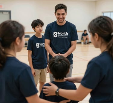 A candid photograph of a family receiving support at a North American community center, the scene conveying compassion and stability, with dark navy and off-white colors throughout.