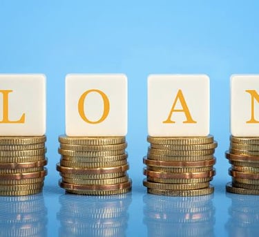 a stack of coins with the words loan on it dream inc loans provider