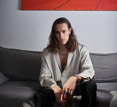 studio photo of a man on a couch