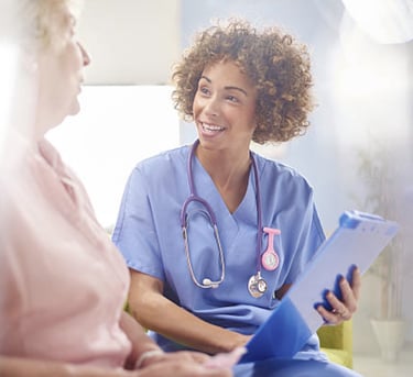 A nurse listening to a patient. 