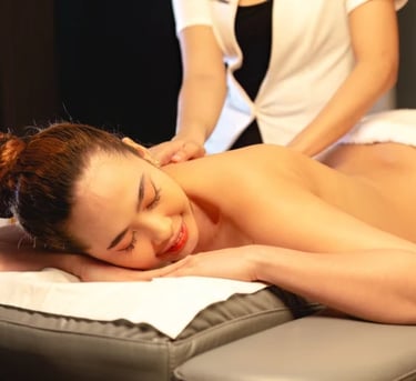 a woman getting a massage at a spa