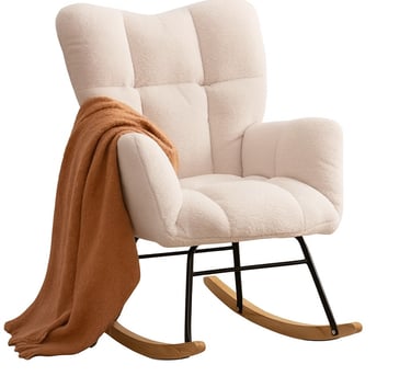 a cream rocking chair with a blanket on it