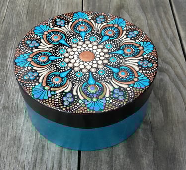 a decorative box with a blue and white flower design