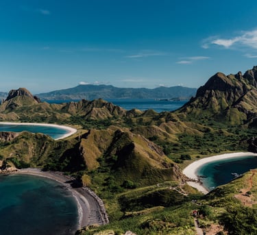 a view of a beach with a mountain in the background