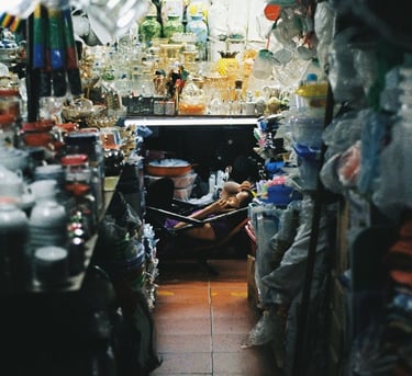 Market vendor relaxing in Saigon