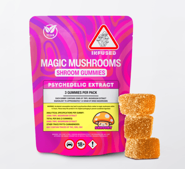 A pink package of vegan infused magic mushroom gummies next to three sugar-coated psychedelic mushroom edibles.