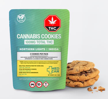A stack of chocolate chip cannabis cookies next to a green and blue 100mg THC edible package.