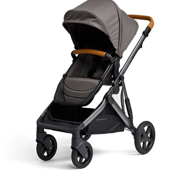 Product photography - a stroller with brown leather handles