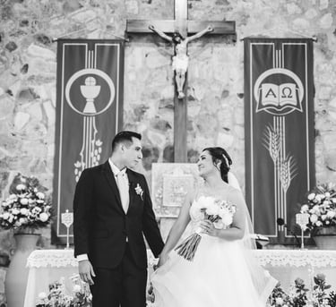a bride and groom holding hands in a church