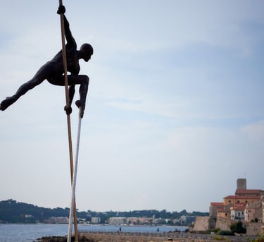 Sculptur of a man is doing a pole
