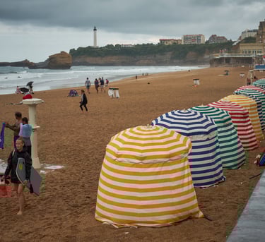 a beach with many umbrellas and umbrellas