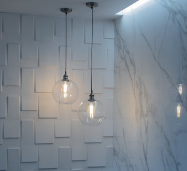 a couple of light bulbs hanging from a ceiling